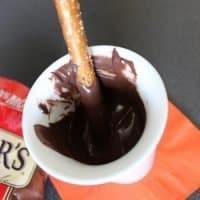 Melted chocolate with pretzel stick