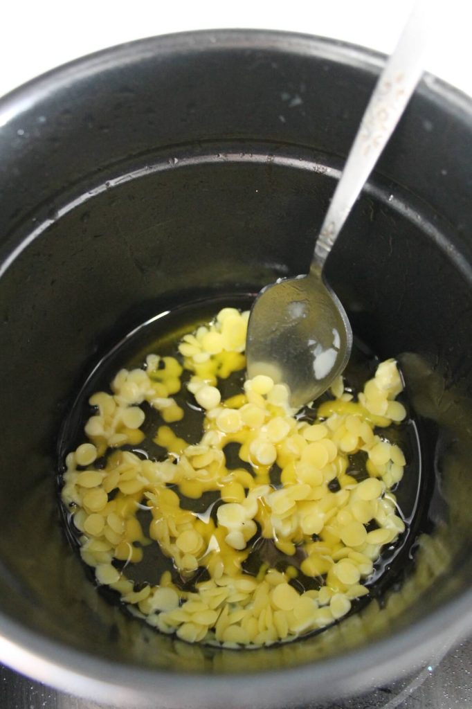 Beeswax in a pot with carrier oil.