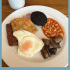 Scottish breakfast food with text overlay.