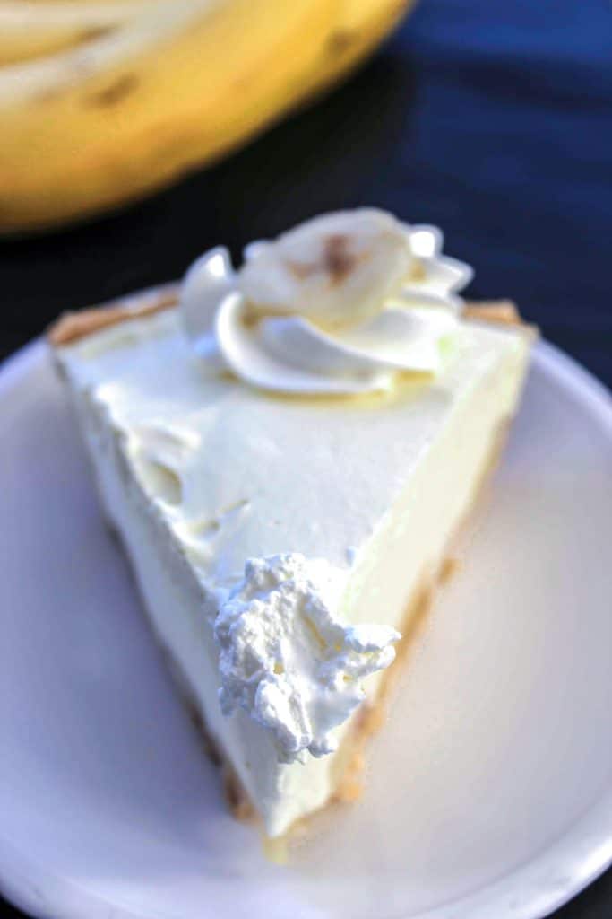 A slice of banana pudding pie on a plate.