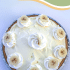 Whole banana cream pie with text overlay describing recipe.