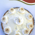 Whole banana pudding pie with text overlay describing recipe.
