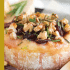 Cranberry baked brie with honey, walnuts, and rosemary with text describing the image.