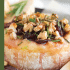 Cranberry baked brie with honey, walnuts, and rosemary with text describing the image.