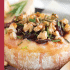 Cranberry baked brie with honey, walnuts, and rosemary with text describing the image.