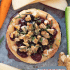 Cranberry baked brie with honey, walnuts, and rosemary with text describing the image.