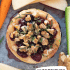 Cranberry baked brie with honey, walnuts, and rosemary with text describing the image.