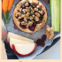 Cranberry baked brie with honey, walnuts, and rosemary with text describing the image.